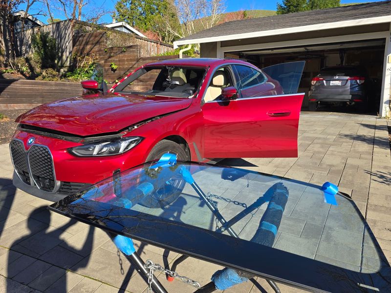 BMW iX windshield prepped on the stand for a Northridge install